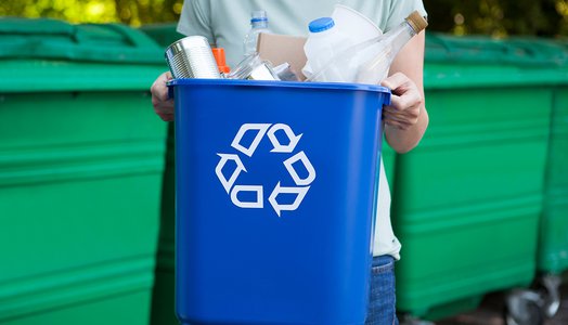 Close-Up-Of-Woman-Carrying-Recycling-Bin-